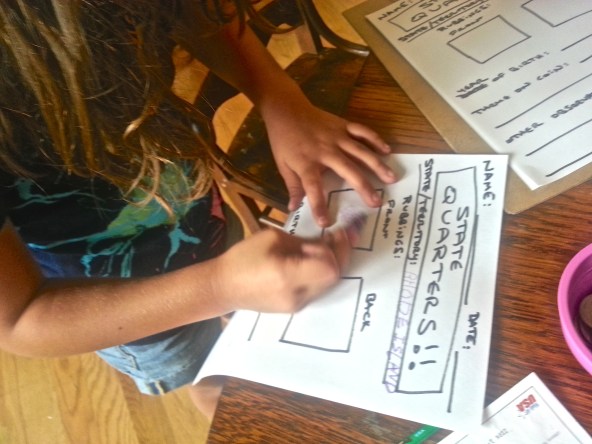 Olivia rubbing New Hampshire Coin