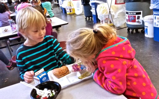 Lets his sister have a bite (GREAT BROTHER!)