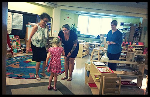 ClaraJane is greeted by Ms. Mayya, Ms. KariAnne and Ms. Pat