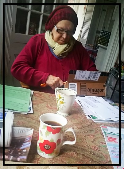Mom opening mail over coffee