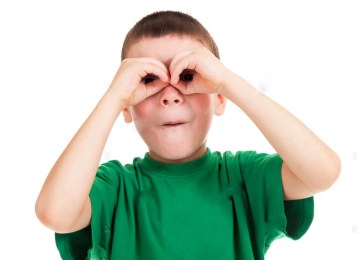 boy-looks-through-his-hands-like-binoculars-ERHXBA.jpg